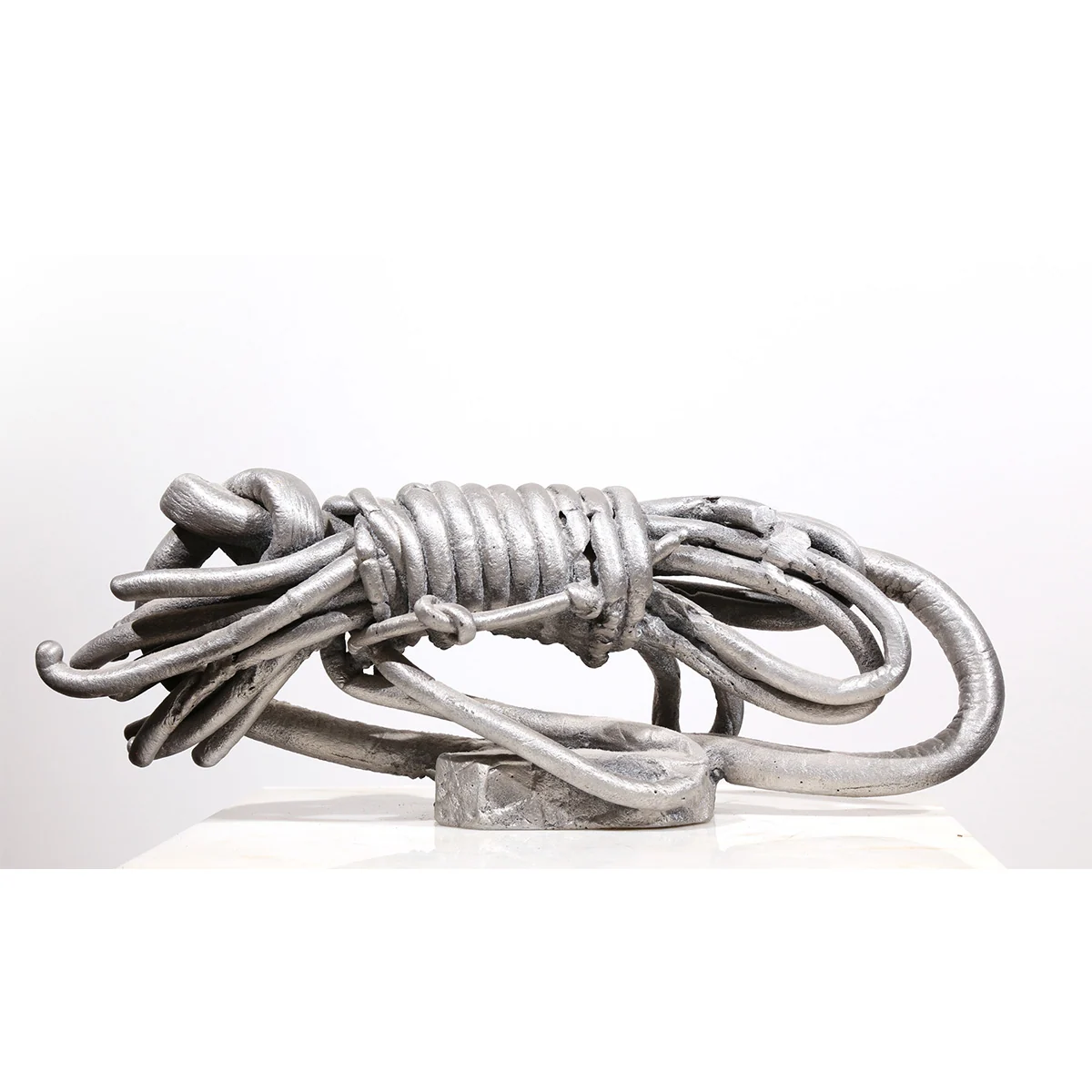 Wrapped | aluminum | 5 1/2 x 5 1/2 x 15 inches- Knot- Pure -Knots- Sand-casted -aluminum -sculpture -by -Mel -Hantz