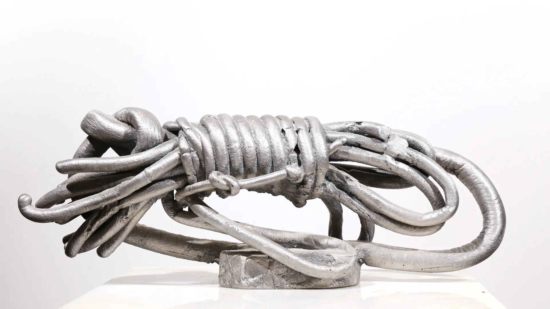 Wrapped | aluminum | 5 1/2 x 5 1/2 x 15 inches Knot, Pure Knots, Sand-casted aluminum sculpture by Mel Hantz