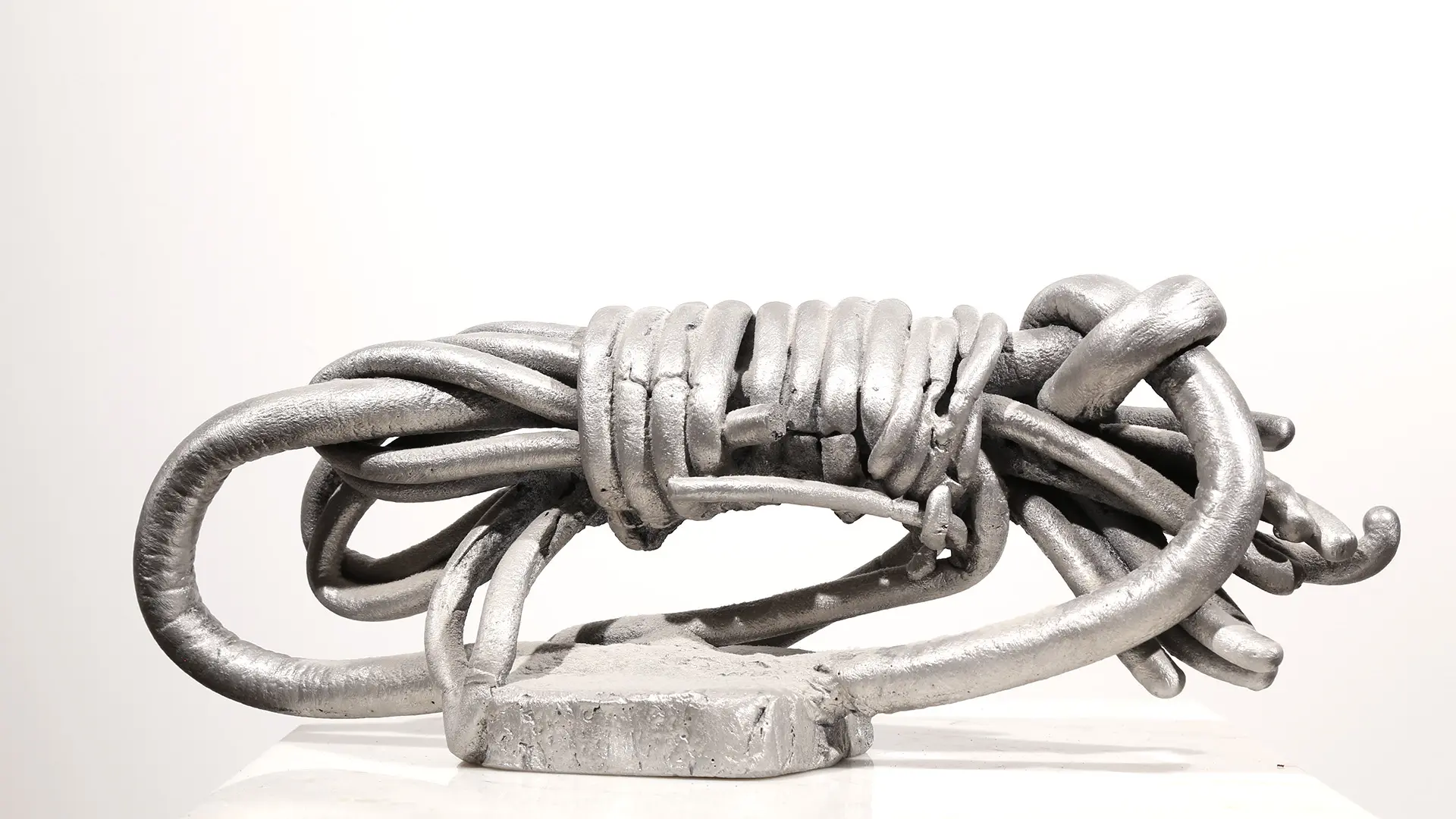 Wrapped | aluminum | 5 1/2 x 5 1/2 x 15 inches Knot, Pure Knots, Sand-casted aluminum sculpture by Mel Hantz