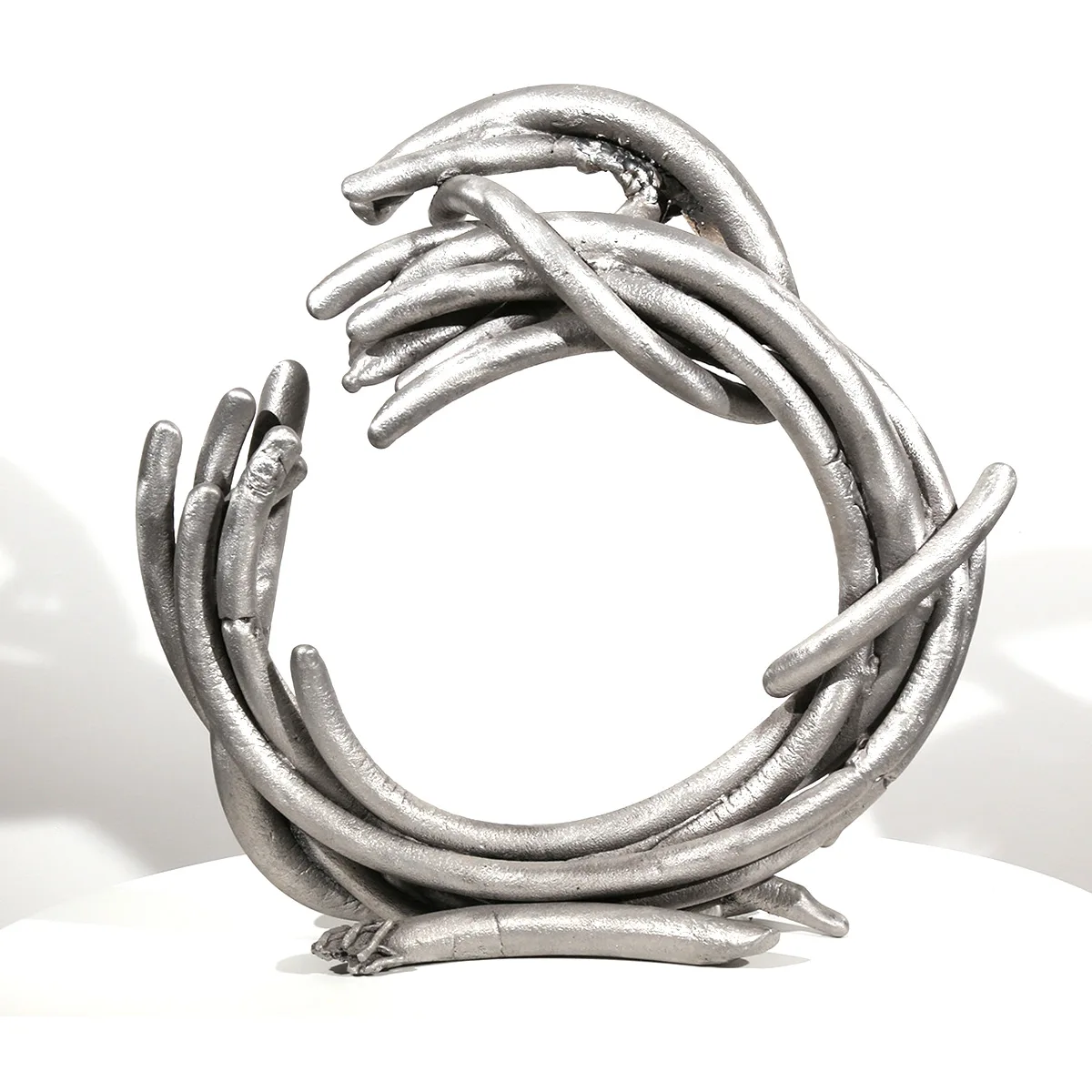 Cessation | aluminum | 17 x 17 x 5 inches- Knot- Pure- Knots- Sand-casted -aluminum- sculpture -by- Mel- Hantz