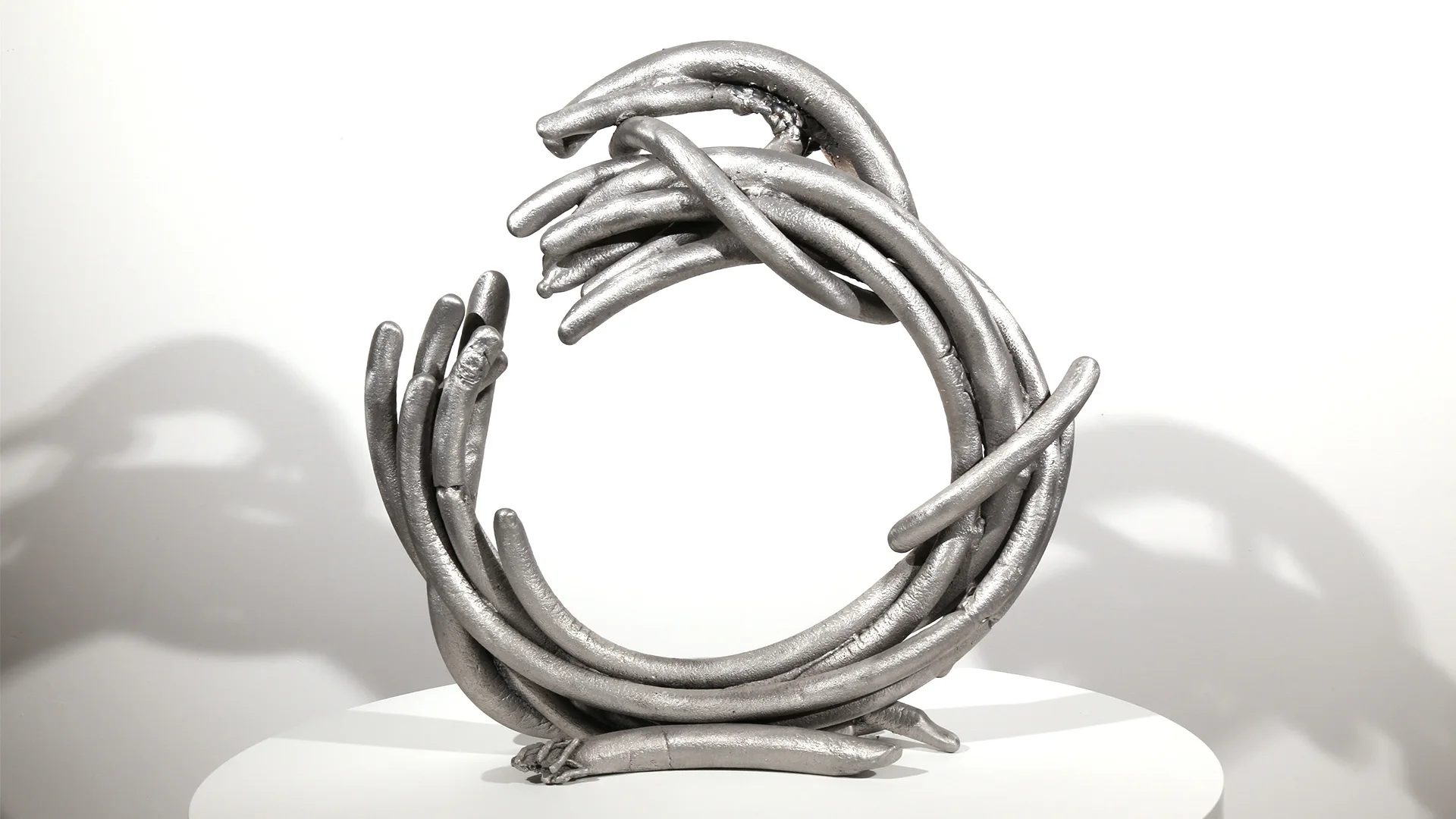 Cessation | aluminum | 17 x 17 x 5 inches Knot, Pure Knots, Sand-casted aluminum sculpture by Mel Hantz